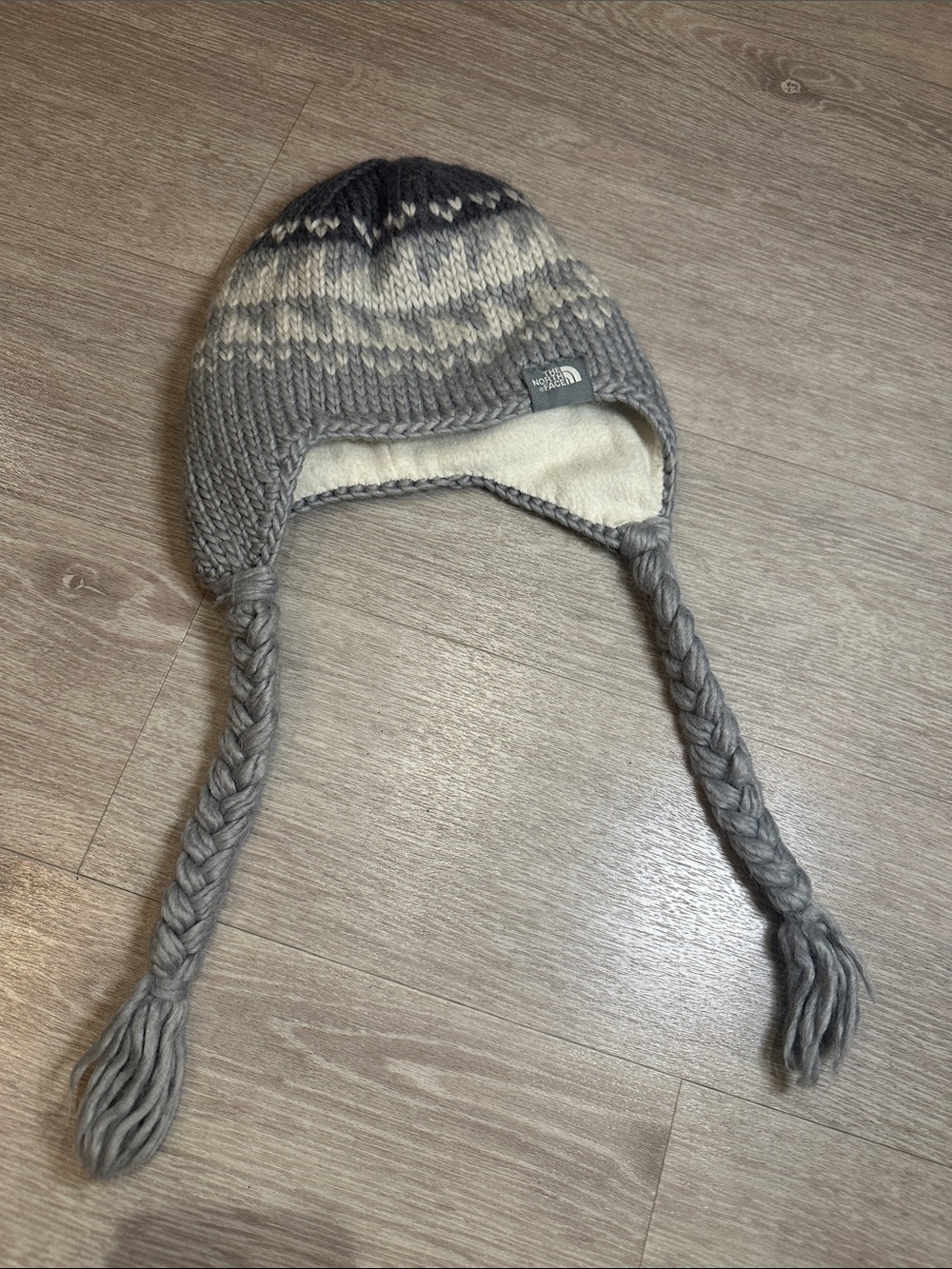 The North Face Grey Knit Earflap Beanie. Preowned in good condition